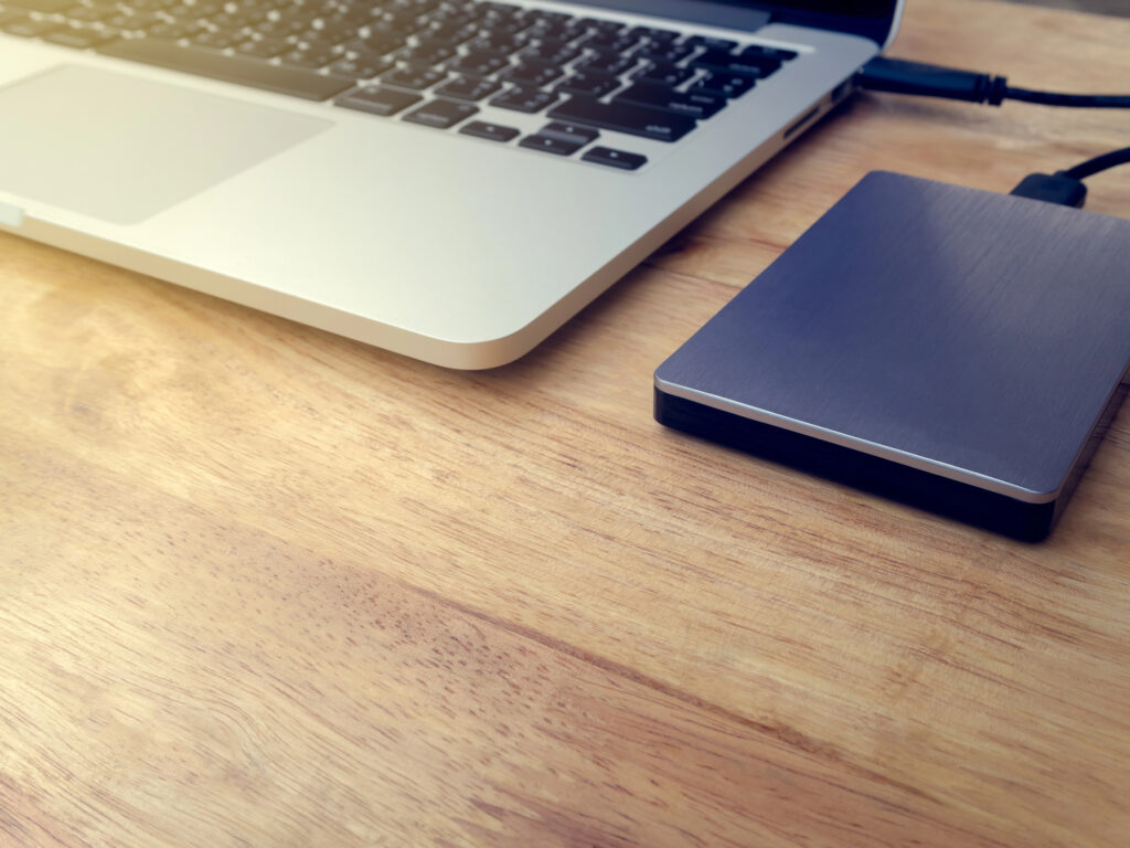 External drive connected to a laptop for a data transfer
